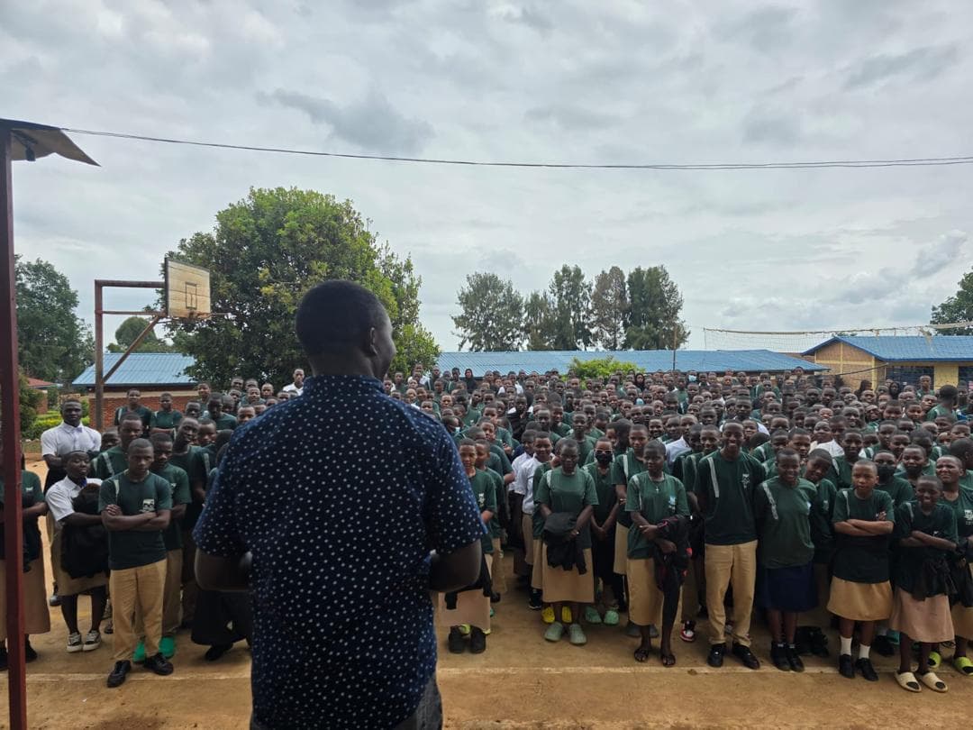 African youth learning and smiling - Goshen Missions